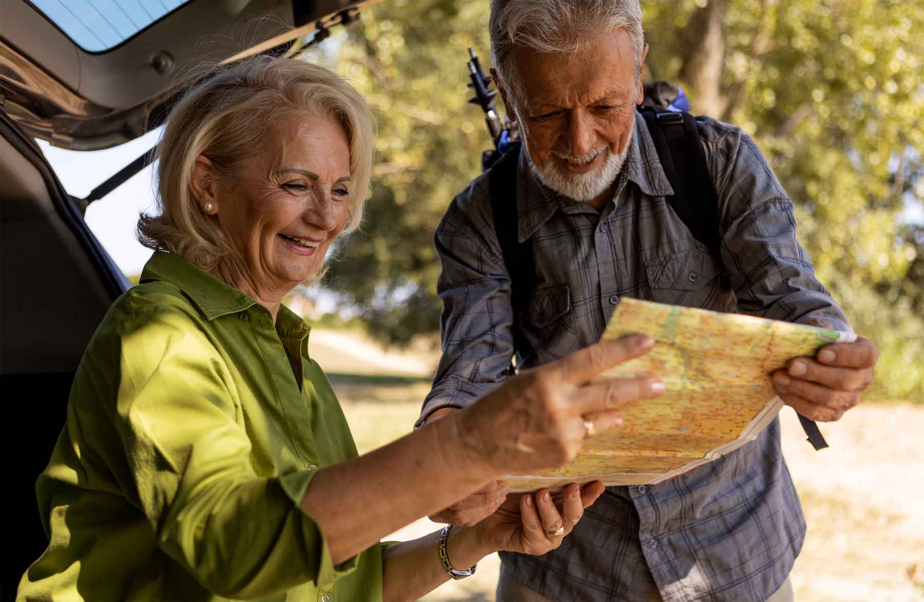 Senior couple looking at map